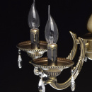 Metalowy żyrandol w kolorze antycznego mosiądzu i z kryształami Aurora MW-LIGHT 371011605